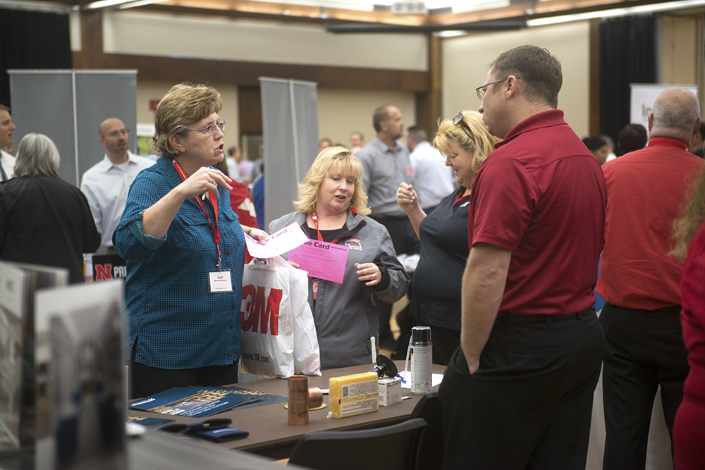 Photo of suppliers interacting with attendees at the Supplier Showcase event
